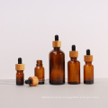 Frosted custom cosmetic skin care glass dropper bottle 5ml 10ml 15ml 20ml 30 ml 50ml 100ml with bamboo lid for essential oil